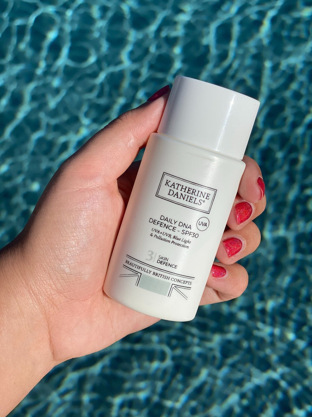 Katherine Daniels Daily DNA Defence SPF30 held in hand