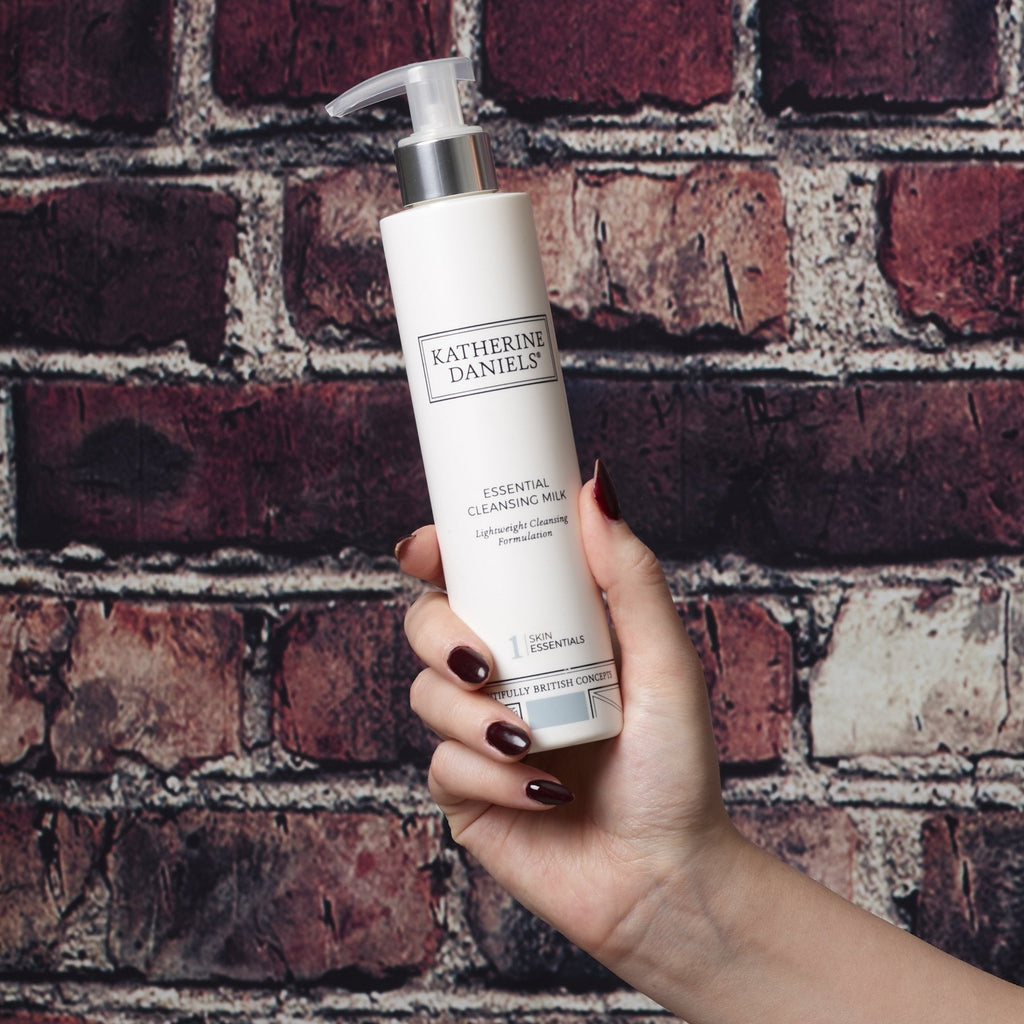 Katherine Daniels Essential Cleansing Milk held in hand