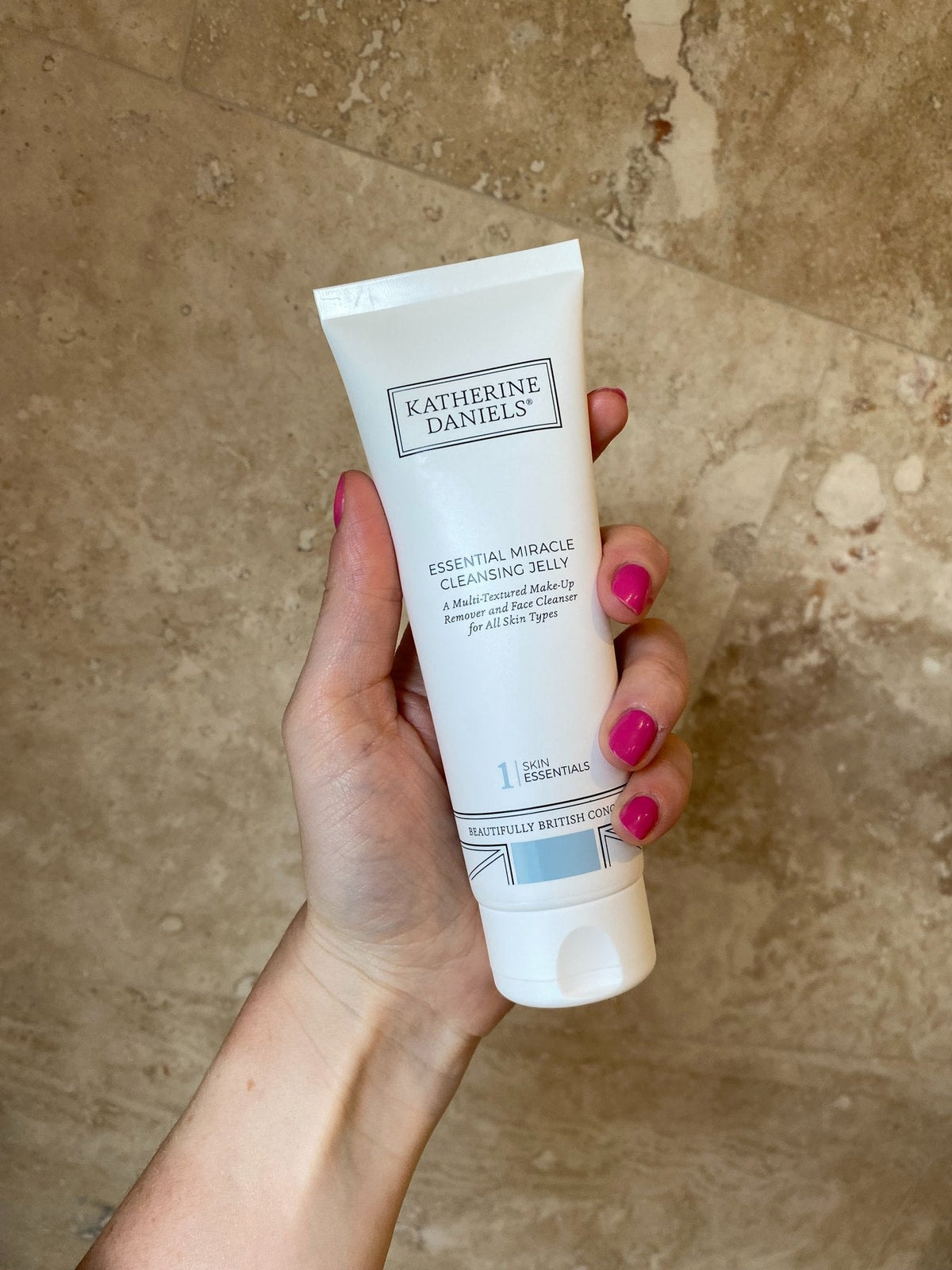 Katherine Daniels Essential Miracle Cleansing Jelly held in hand