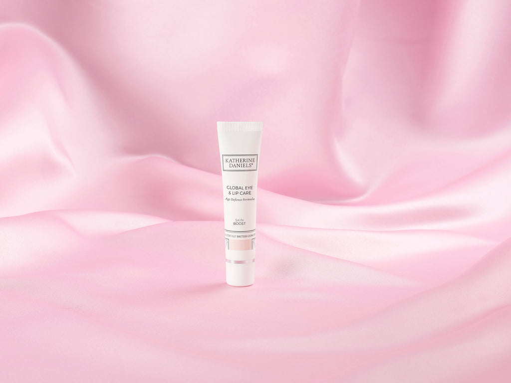 Katherine Daniels Global Eye & Lip Care on pink silk