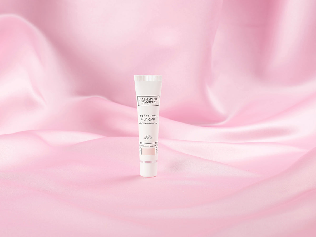 Katherine Daniels Global Eye & Lip Care on pink silk