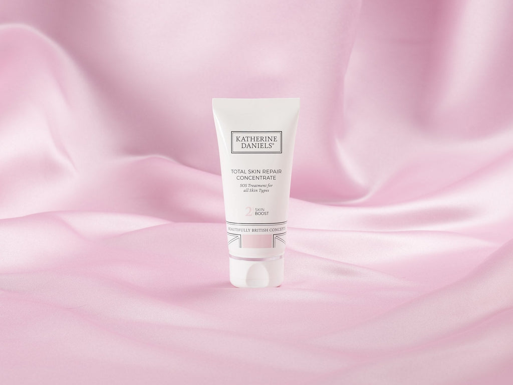 Katherine Daniels Total Skin Repair Concentrate on pink silk