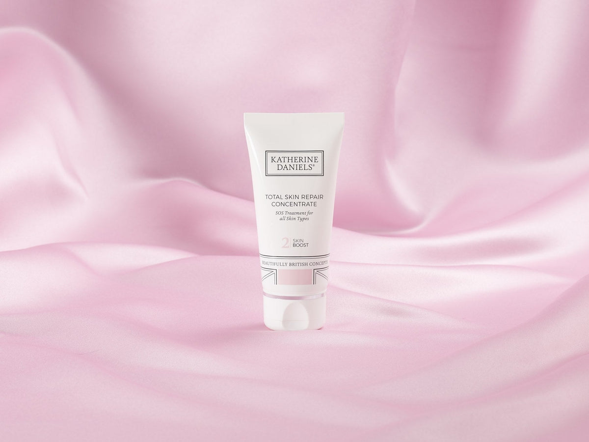 Katherine Daniels Total Skin Repair Concentrate on pink silk